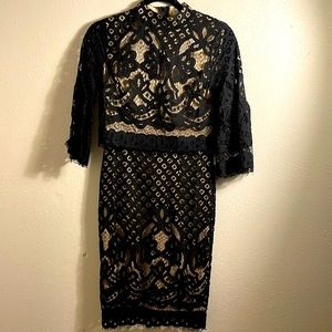 Ivy City X Small beautiful black lace dress lined in nude perfect condition